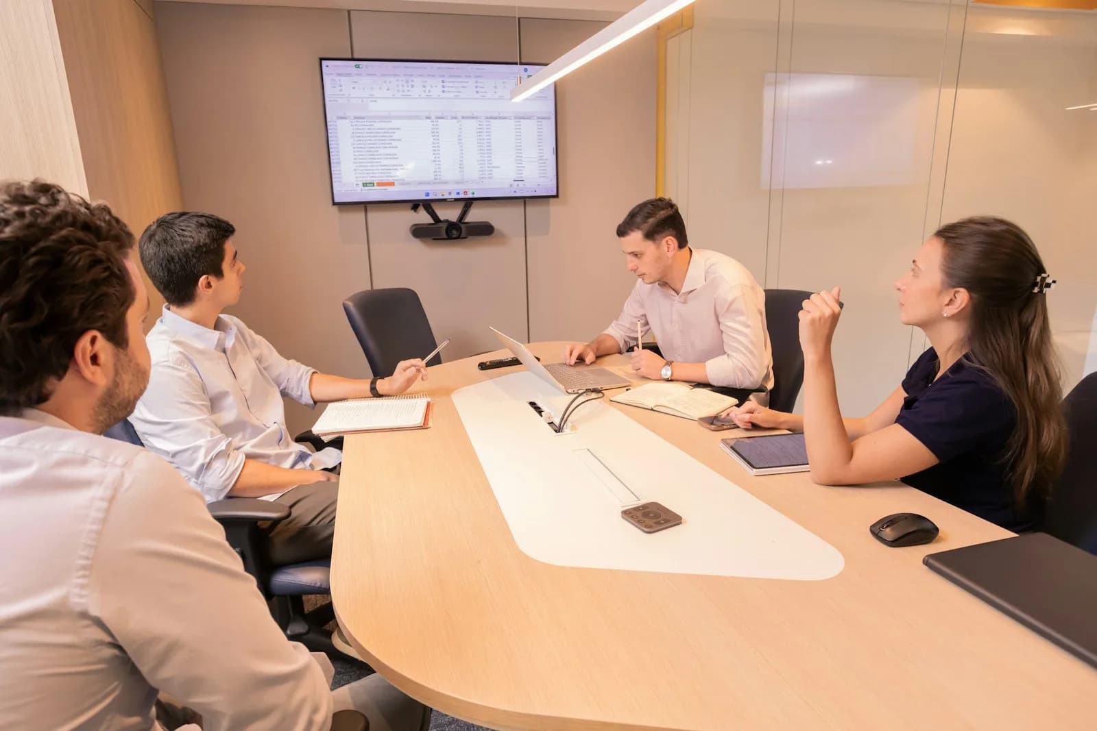 A corporate meeting around a boardroom table