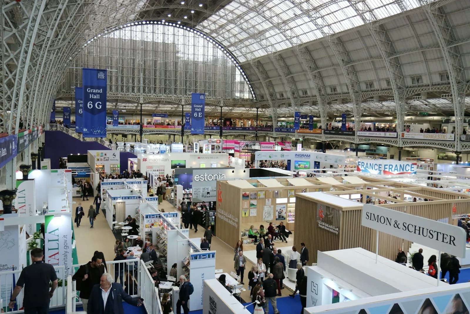 Delegates moving through a large convention venue