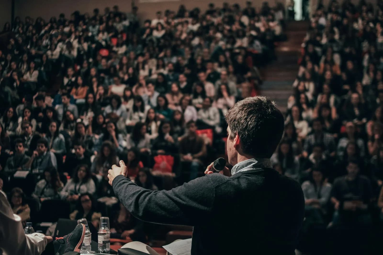 A speaker addressing delegates at a business conference