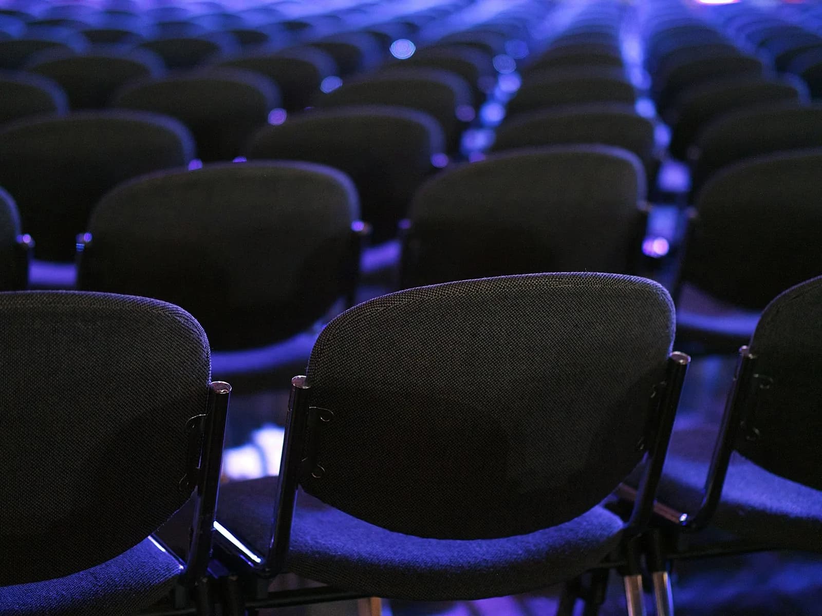Delegates moving through a large convention venue