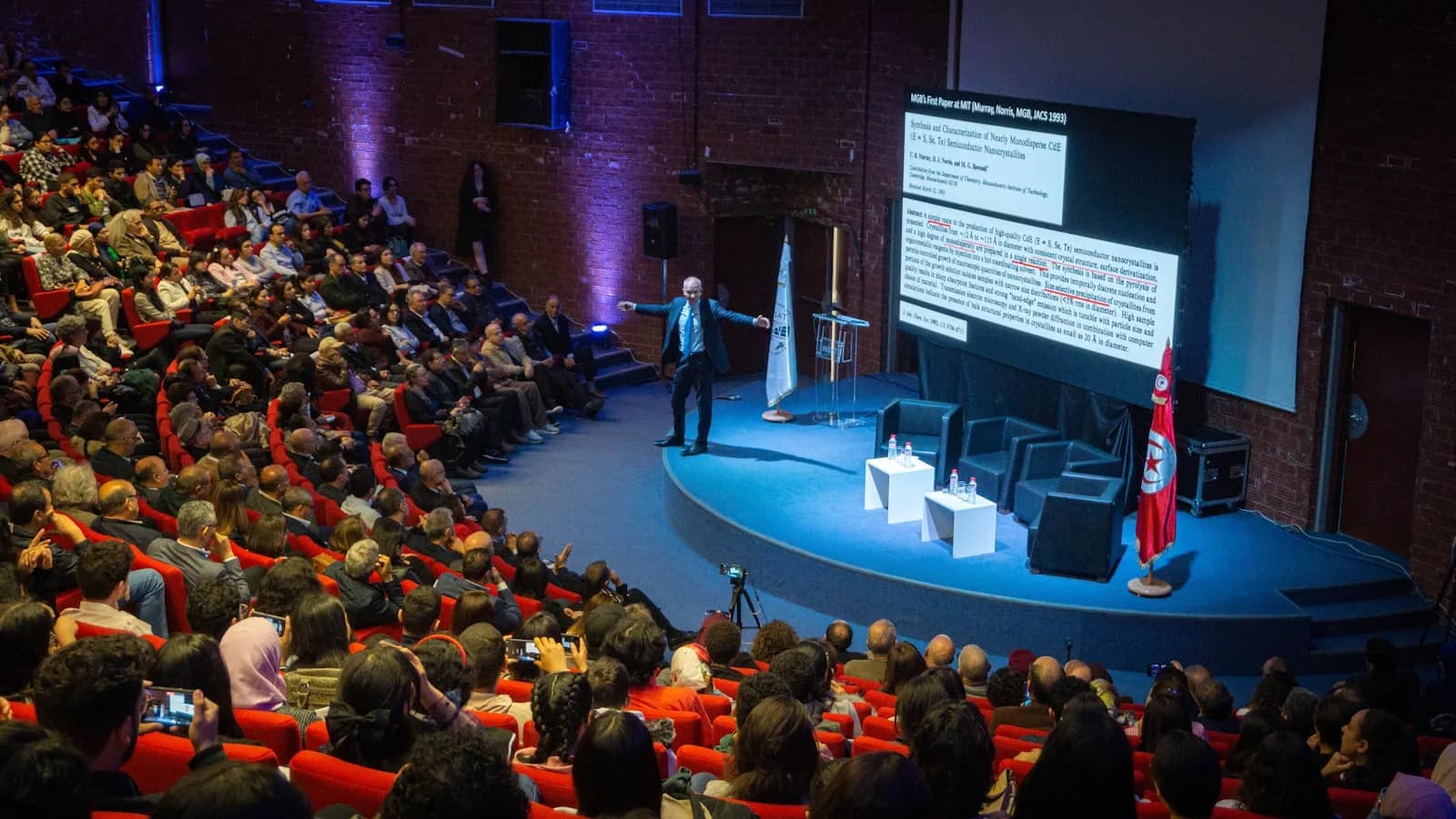 A speaker addressing delegates at a business conference