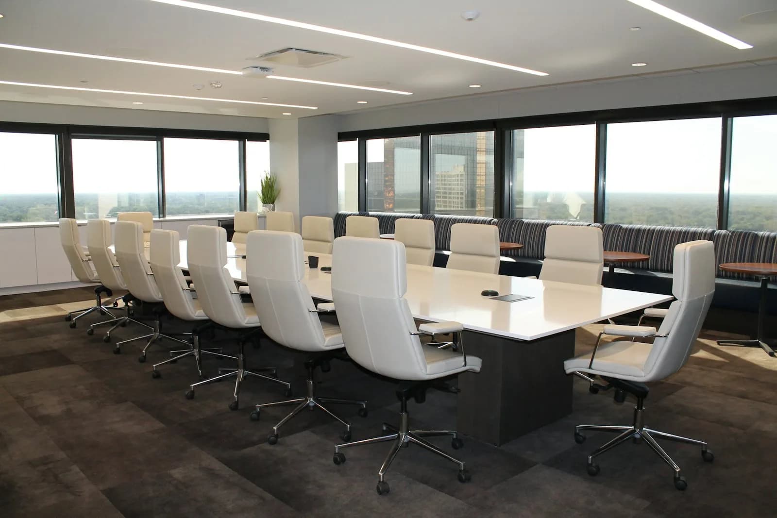 A corporate meeting around a boardroom table