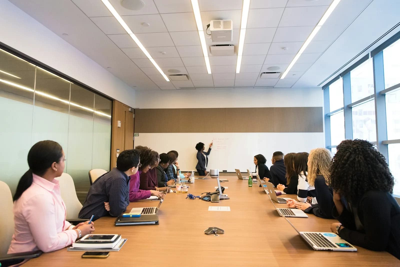 A corporate meeting around a boardroom table in Kuala Lumpur