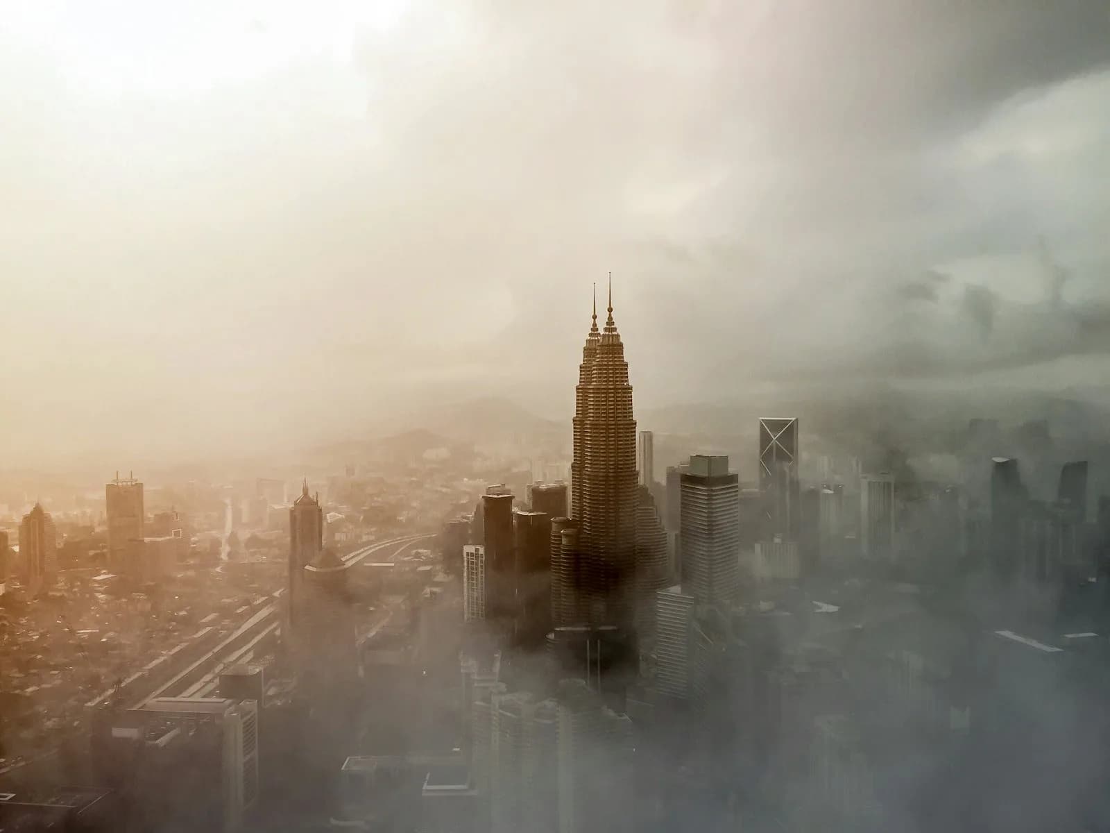 The Petronas Twin Towers above the Kuala Lumpur skyline