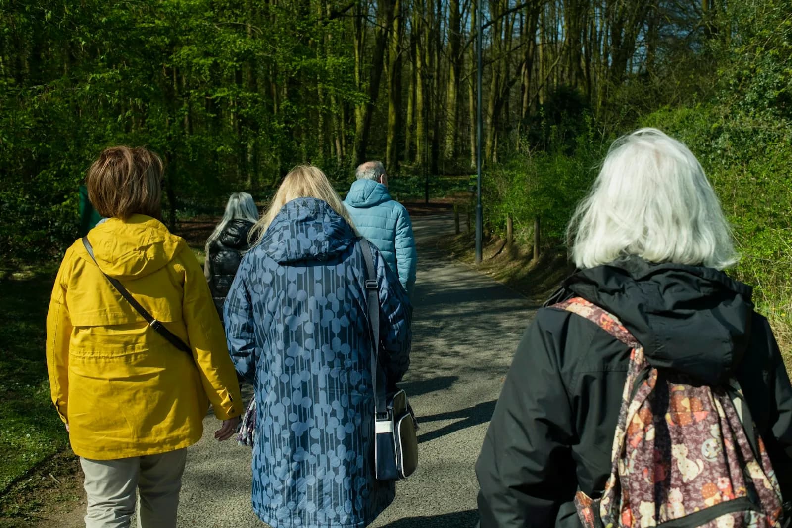 A small tour group with a local guide on a coastal walk