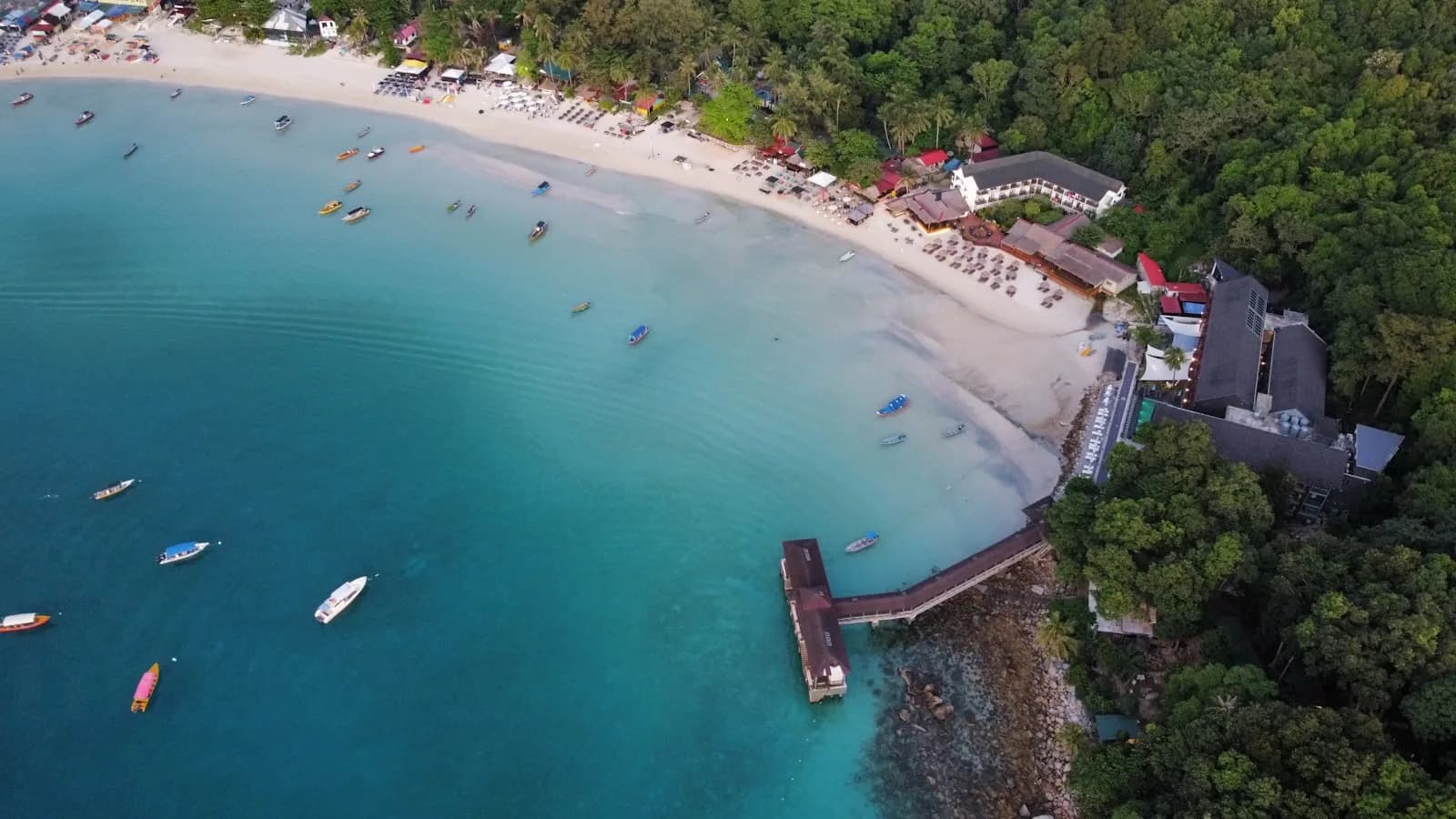 A boat on a calm beach in the Perhentian Islands