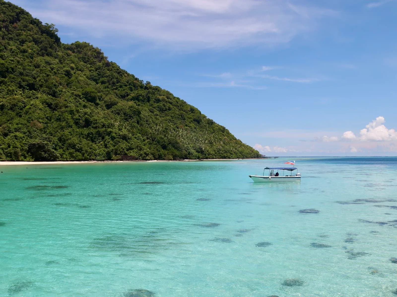 A resort beach on Redang with clear shallow water