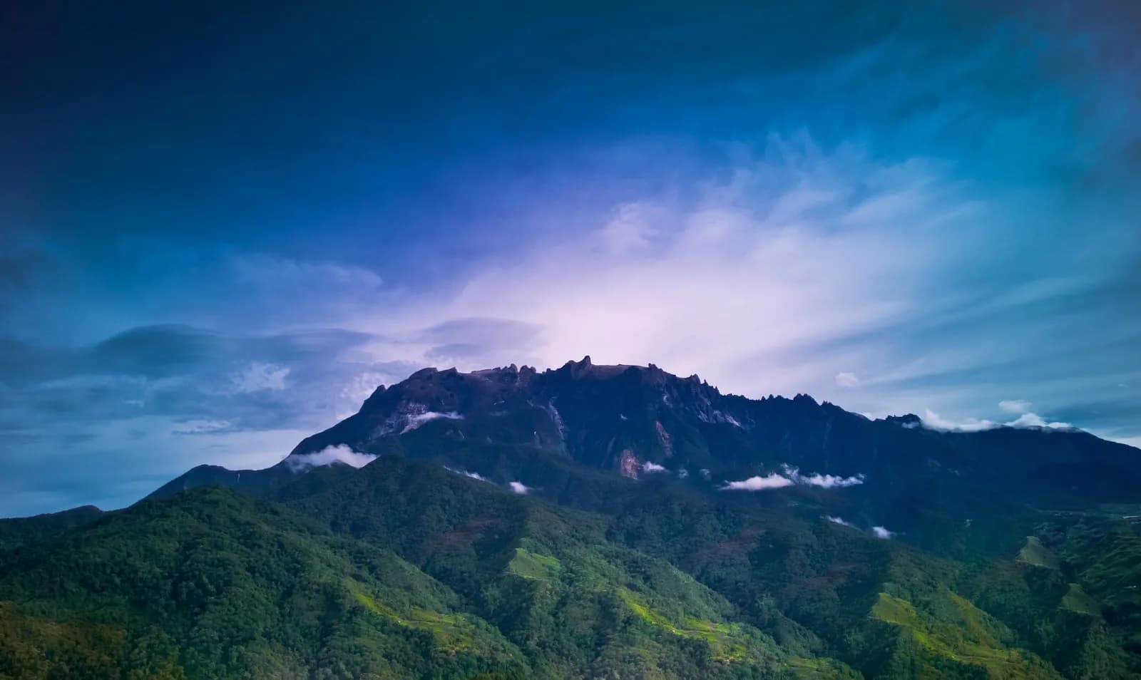Mount Kinabalu rising above the rainforest highlands of Sabah