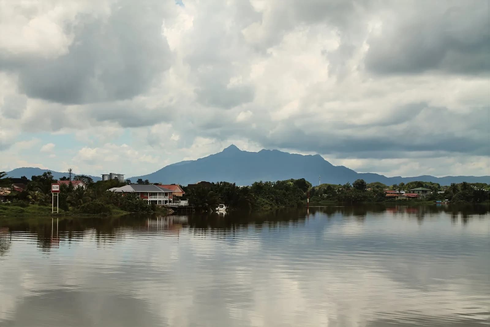 The Sarawak River near Kuching, with hills rising in the distance