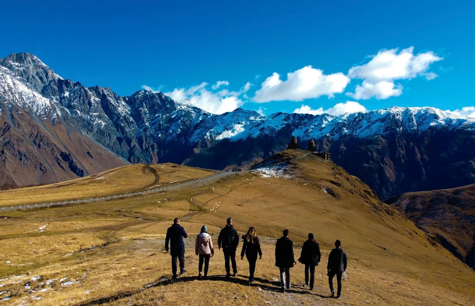 A small tour group with a local guide on a rainforest trail