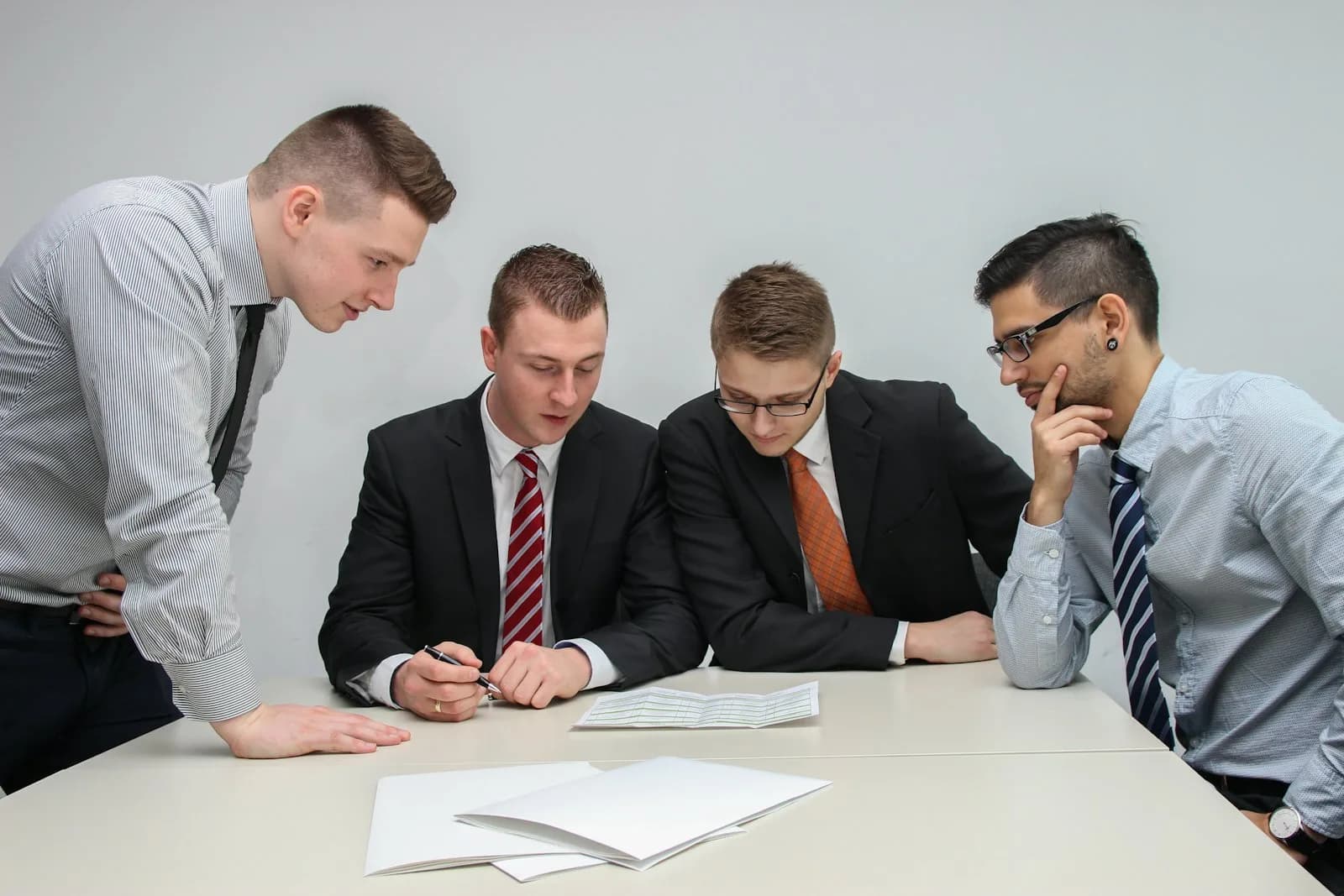 A ground operations team reviewing plans around a table