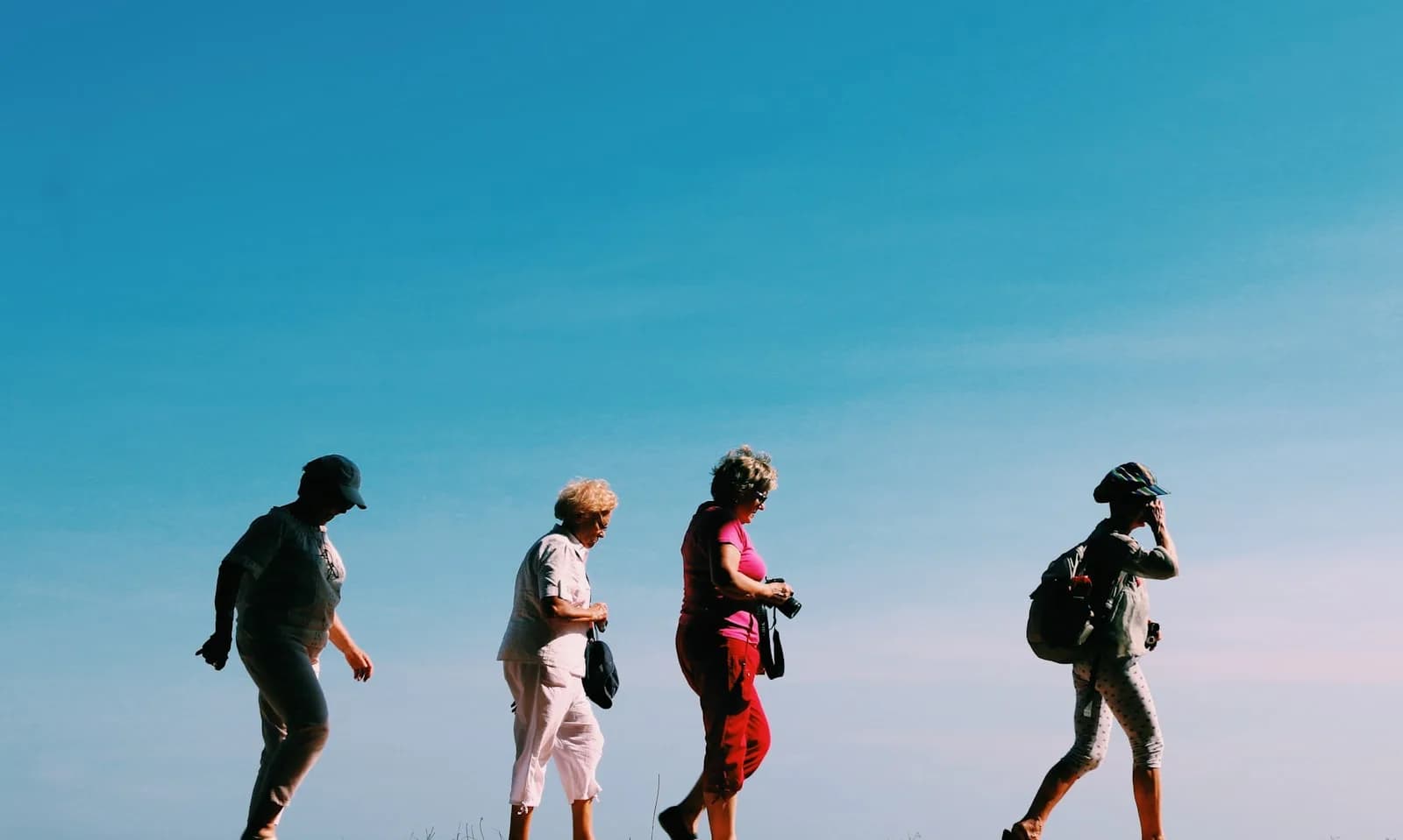 A small tour group with a local guide on a coastal walk
