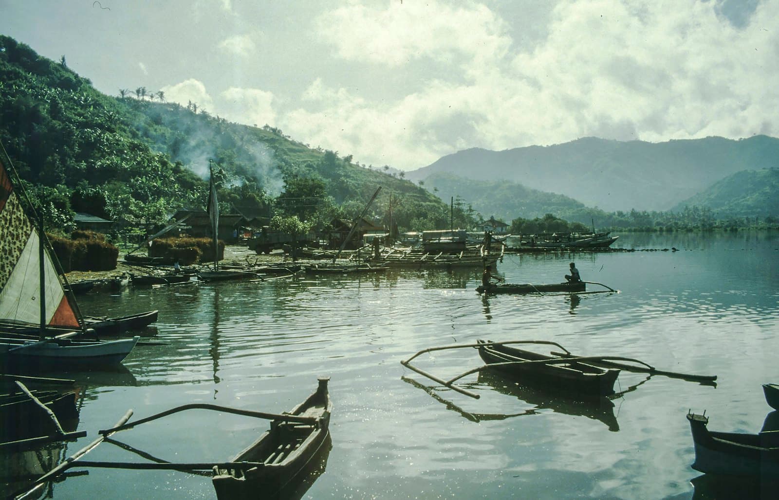 A dive boat over a coral reef in the Tioman marine park