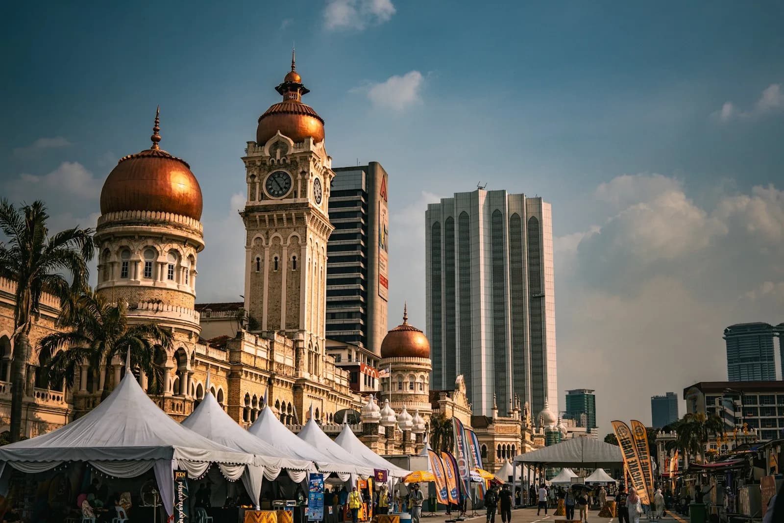 A Kuala Lumpur street scene with the city skyline behind