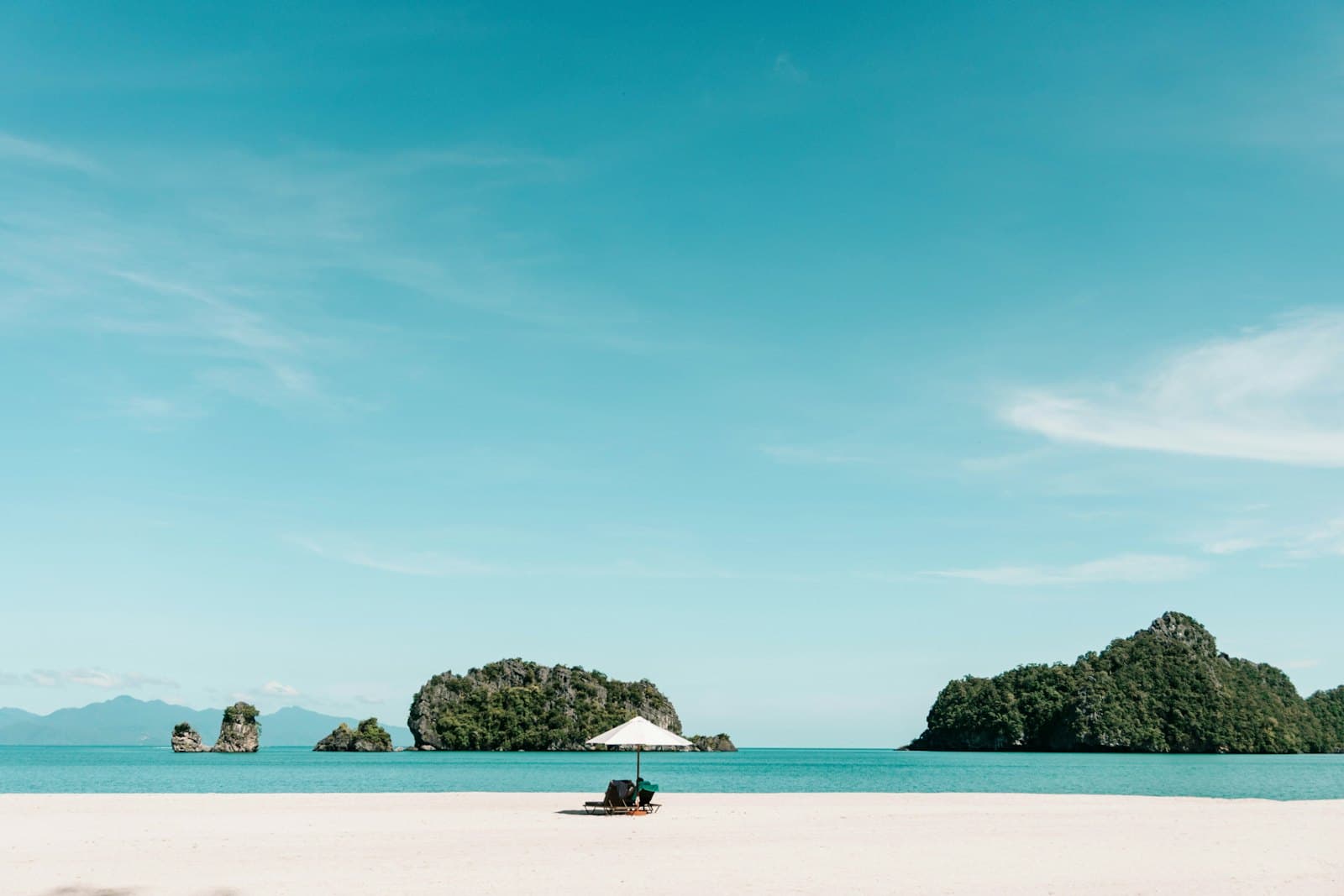 A quiet beach with a traditional boat