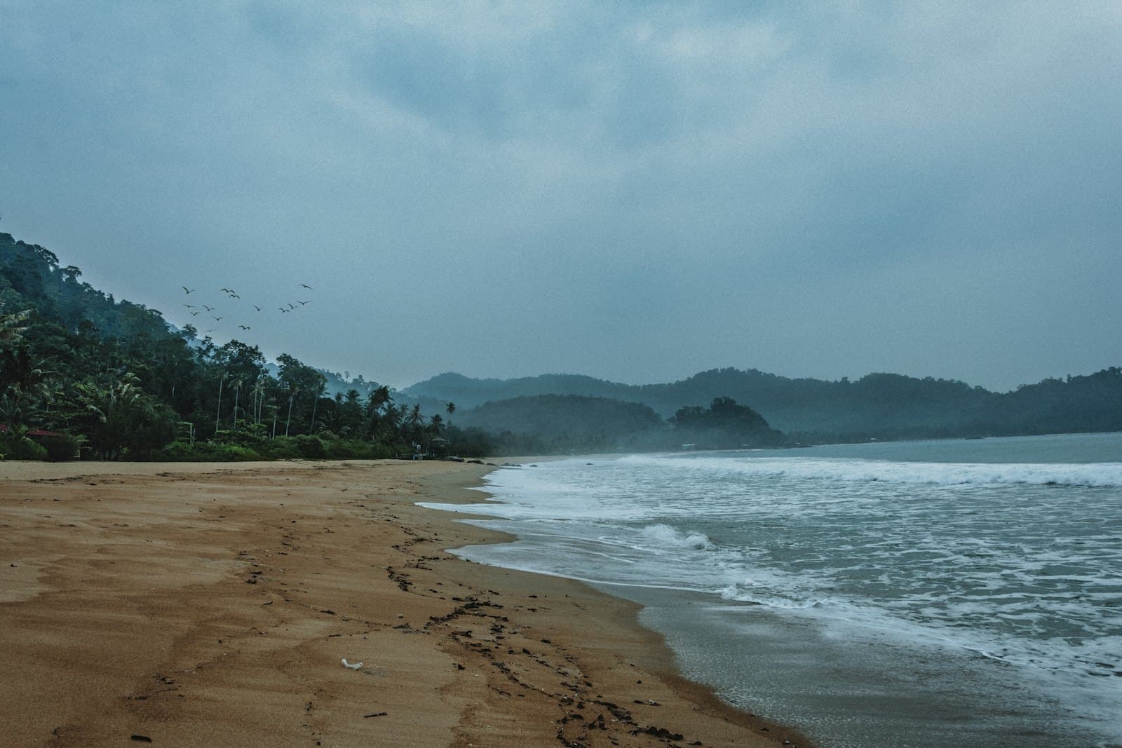 Waves rolling onto a Tioman beach