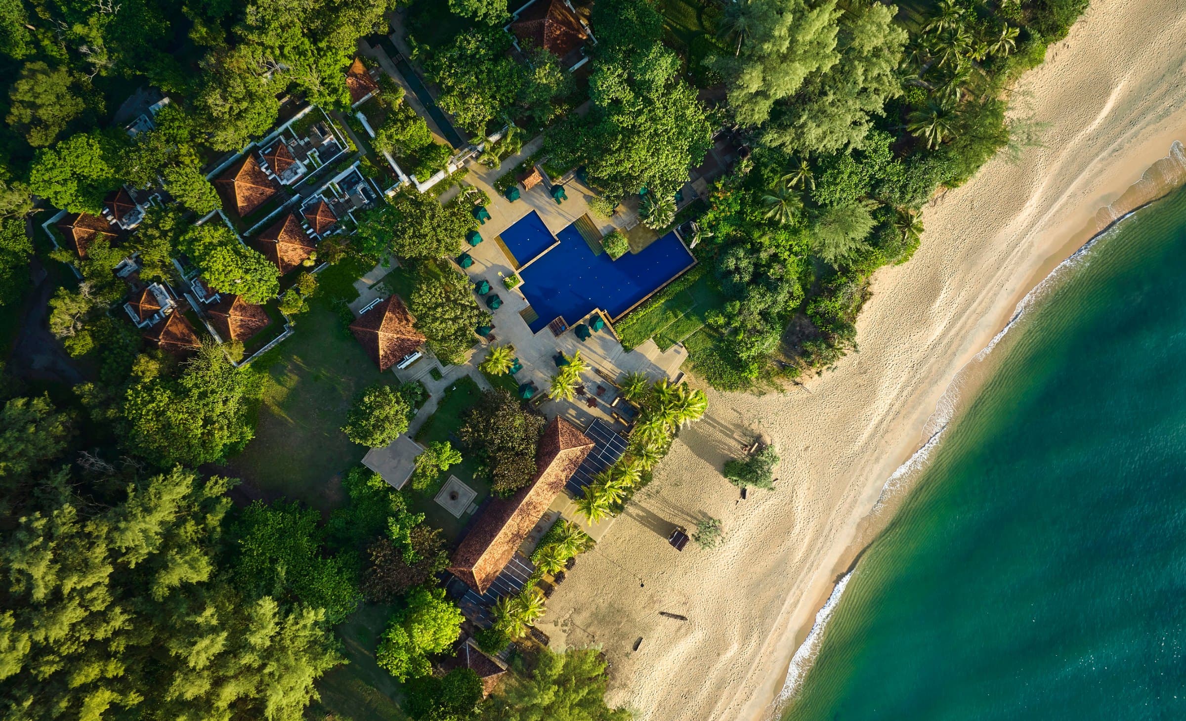 Poolside umbrellas facing the South China Sea, Tanjong Jara Resort